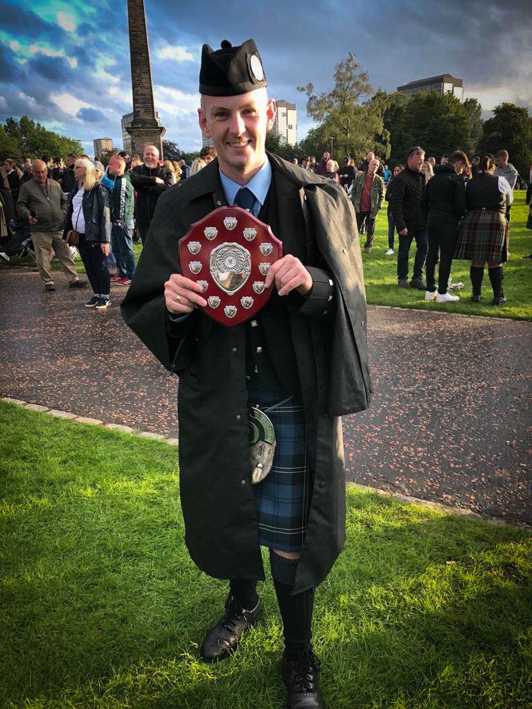 The prize shield held by Stewart Blue